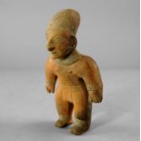 A Pre Columbian terracotta male effigy figure, possibly Jama Coaque, Equador, c. 500 A.D, modelled