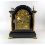 A Victorian ebonised wood bracket clock, 19th century, the case with domed top, brass urn form