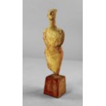 An early marble idol in the form of a standing figure, Greek, from Thessaly or the Cyclades,