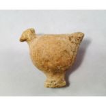 A Bactrian terracotta model of a bird, modelled in the round, with small head and larger ovoid body,