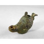 A Roman bronze oil lamp modelled as the head of an African, c. 1st century A.D, his hair arranged as