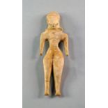 A Syrian Terracotta female idol, c. 2000 B.C. possibly a fertility figure, wearing stylised head-