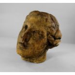 A large Greek style stone head of a classical female, possibly Aphrodite, modelled in the round,