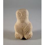 A Costa Rican style carved stone ancestor figure, modelled in the round, with large head bearing