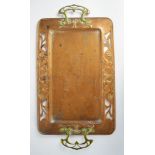 A copper and brass Art Nouveau twin handled tray, with pierced and scrolling foliate decoration,