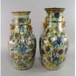 A pair of Chinese Canton baluster vases, 19th century, the moulded bodies painted in famille rose