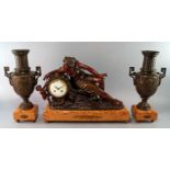 A French patinated spelter mantel clock garniture, late 19th century/early 20th century, the clock