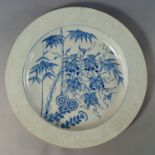 A Chinese export porcelain charger, 18th century, painted in underglaze blue with two squirrels