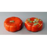 A pair of Chinese porcelain pumpkins, early 19th century, with coral glaze, one painted with