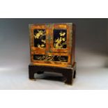 A Japanese hardwood and metal mounted chest on stand, late 19th/early 20th century,