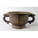 A Chinese bronze Zhou style ritual food vessel, gui, 19th century, with mask set handles,