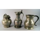 A collection of seven pewter measures, 18th/19th century, of bellied form with curling handles,