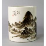 A Chinese porcelain brush pot, bitong, Republic period, painted with an extensive landscape scene