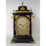 A large ebonised wood and brass mounted Victorian mantel clock by Whitehurst of Derby, with square