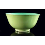 A rare Chinese porcelain monochrome lime green bowl, Guangxu mark and period, of ogee form, glazed