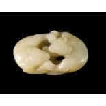 A Chinese mutton fat jade carving, depicting two cats embracing, 7 x 4.5cm. CONDITION REPORT: