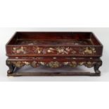 A Chinese rosewood and mother of pearl rectangular stand, early 20th century, inlaid throughout with