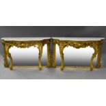 A pair of Victorian gilt gesso console tables , circa 1860, with serpentine white marble tops,