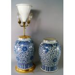 A pair of Chinese porcelain temple vases, 19th century, each set with four lion mask lug handles and