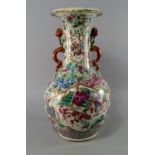 A Chinese Canton porcelain famille rose vase, mid 19th century, painted in famille rose enamels with