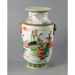 A Chinese vase, in the Kangxi style, 19th century, with lions mask handles, painted with a