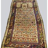 A West Persian prayer rug with repeat trellis of flowers in an ivory field and with multiple border,