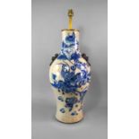 A Chinese porcelain vase, late 19th century, with lions mask and ring handles, painted in underglaze