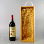 A bottle of Chateau Petrus 1994, in wooden gift box, ullages to lower neck, label in good condition,