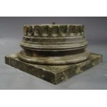 A green marble column base, the top with fluted decoration, on turned and square foot,