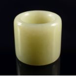 A Chinese pale green jade archer's thumb ring, early 20th century,