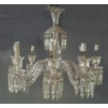 An eight light glass chandelier, probably by Baccarat, the baluster column with twisted moulding