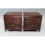 A pair of Chinese stained hardwood bedside cabinets, 20th century, of square form with single frieze