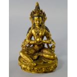 A Sino-Tibetan gilt bronze figure of a Tara, 19th century, seated in lalitasana on a lotus throne,