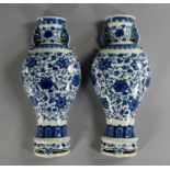 A pair of Chinese porcelain vase shaped wall pockets, 20th century, each painted in underglaze