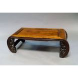 A Chinese hardwood low table, late 19th/early 20th century, the curving ends with carved cloud
