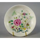 A Chinese porcelain shallow bowl, Guangxu mark and period, painted in famille rose enamels with