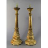 A pair of alabaster and metal pricket stick candlesticks, 20th century, 48cm high CONDITION