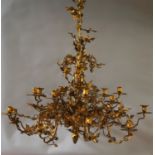 A gilt metal eighteen light chandelier, late 19th/20th century, with central column and pendant