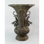 A large Japanese bronze vase, 19th century, of quatrefoil form with pierced panels of confronting
