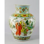 A Chinese porcelain baluster vase, 19th century, painted in famille verte enamels with elders eating