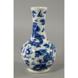 A Chinese porcelain bottle vase, Guangxu mark and period, painted in underglaze blue to the neck