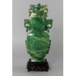 A Chinese green hardstone archaistic vase and cover, 20th century, the cover with dragon and loose