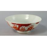 A Chinese porcelain bowl, 19th century, painted in iron oxide red and heightened with gilt with