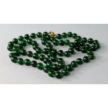 A Chinese jadeite bead necklace, 20th century,