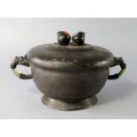 A Chinese pewter and hardstone food dish and cover, early 20th century, the twin peach finial set