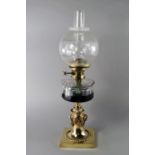 A Victorian brass oil lamp, with cylindrical faceted reservoir, on moulded spreading column,