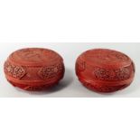 A pair of Chinese red cinnabar lacquer boxes and covers, late 18th century, decorated with scenes of