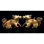 A pair of Chinese carved ivory kylin, 19th century,