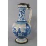 A Dutch delft and pewter mounted ewer, late 17th century, of globular form with looping handle on