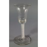 An English drinking glass, 18th century, the bowl of inverted bell shape,